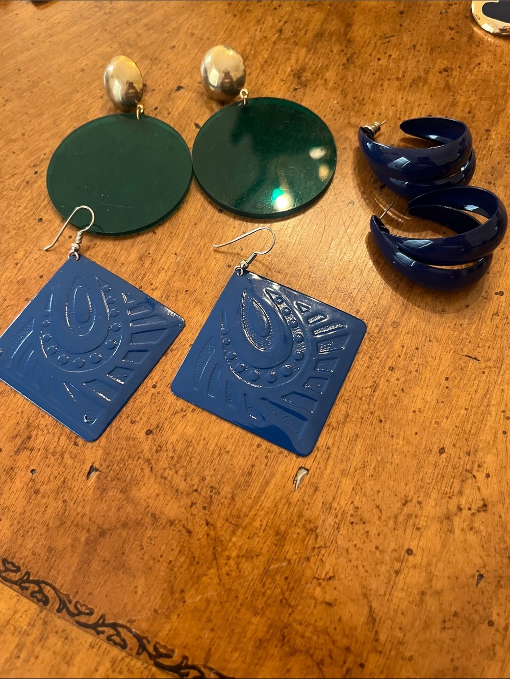 Three pairs of large statement earrings